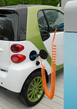 Charging of electric car on station.