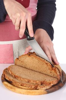 details cutting bread with knife in closeup