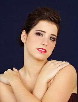 portrait of a beautiful young woman, dark blue background