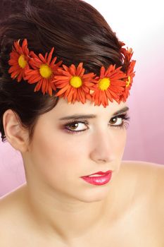 Woman with flower crown, pink background