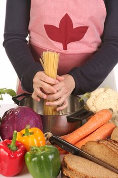 housewife preparing Spaghetti in the pot with vegetables