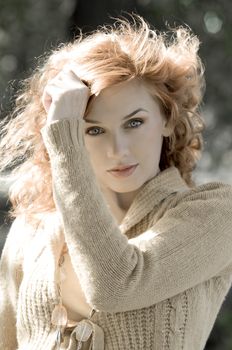 desaturated portrait of a pretty woman in a autumn outdoor shot