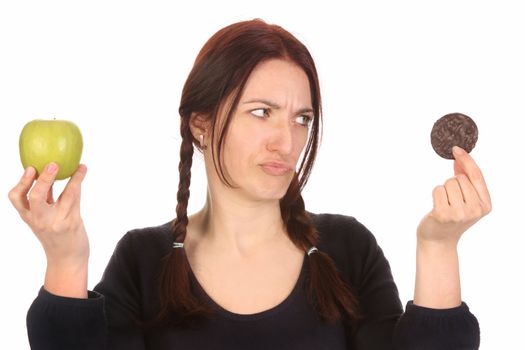 beautiful woman choosing between chocolate cookies and apple on white background 