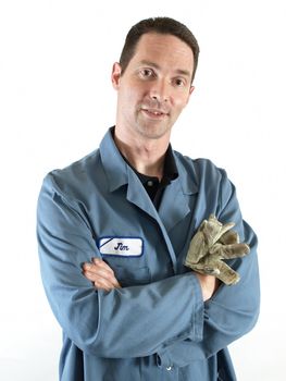 A male employee in a blue lab coat stands with his arms crossed.