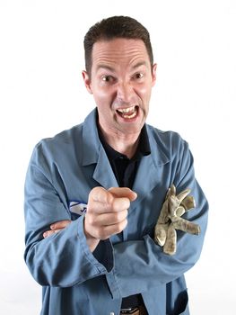 A man in a blue smock points and yells in anger and frustration.