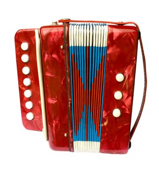 A small red children's accordion isolated on white background