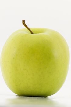 closeup of one green apple on white background 