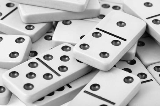 The old gray dominoes with black spots close up