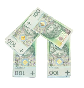House built with the money. Banknotes PLN 100. Expensive housing