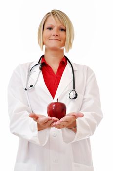 Female doctor with apple in hand and stethoscope isolated on white background.