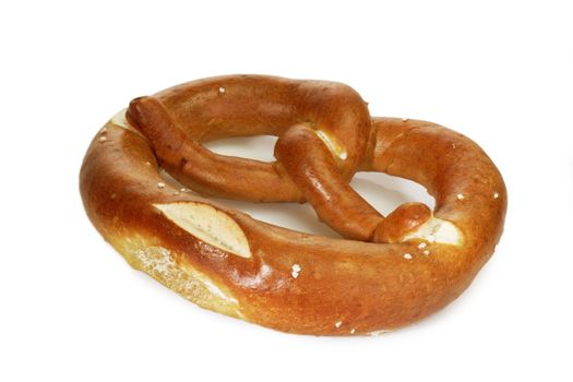 Salted pretzel on bright background