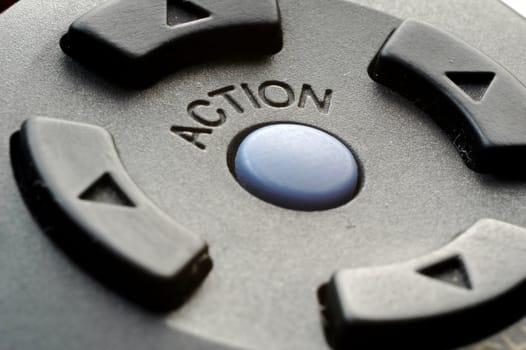 Closeup of action button on remote control. Concept 