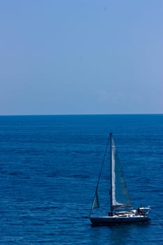 Speed boat on calm blue sea water.