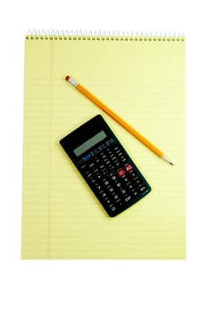 Spiral notebook, calculator, and pencil isolated on white background with clipping path.