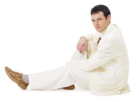 A man in a light business suit siting on white background