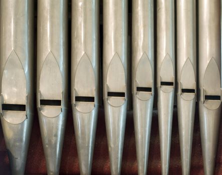 a row of organ pipes on an old church organ