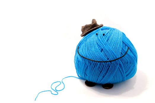 Toy from blue itch in brown hat,on white background
