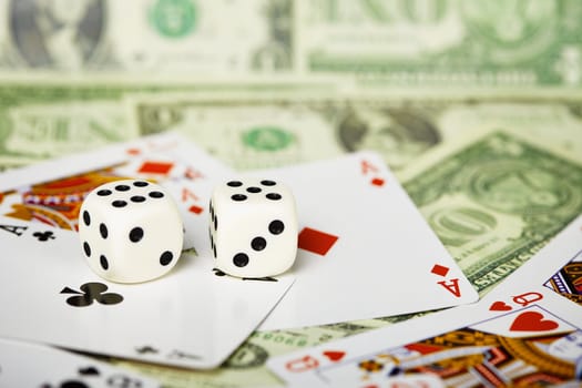 White dices are on the cards and money