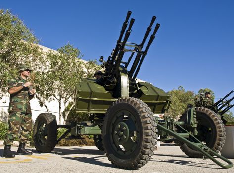 MALTA- OCTOBER 06 - Soldiers demonstrating an Anti-Aircraft Gun during an Armed Forces of Malta open day at Luqa Barracks