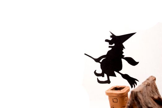 Witch,flying on broom on house,on white background
