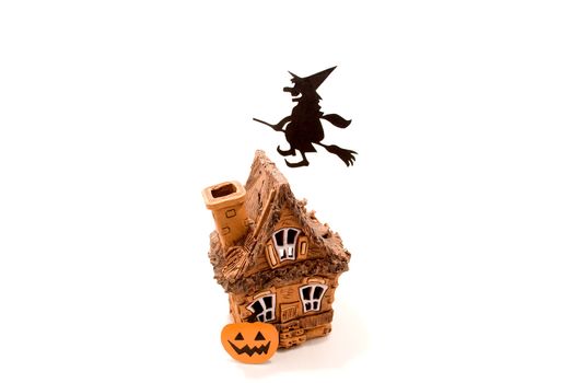 Witch,flying on broom on house,on white background
