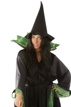 pretty woman with blue eyes in witch dress with hat