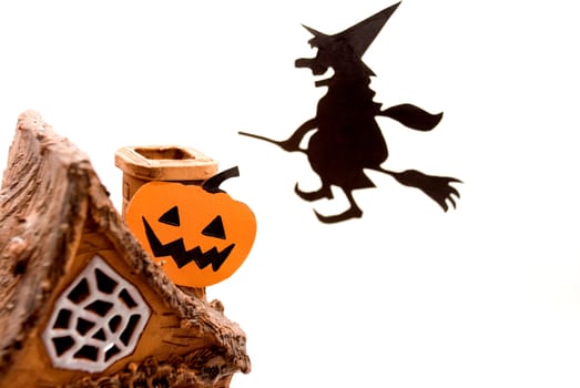 Witch,flying on broom on house,on white background
