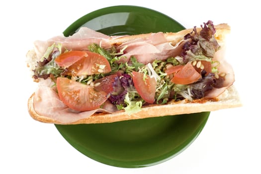 a fresh and healthy baguette with ham and vegetables
