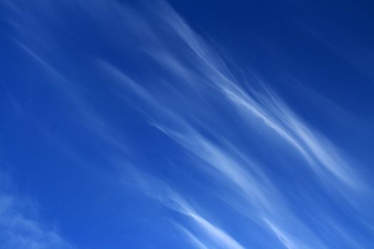 blue sky with fleecy clouds background