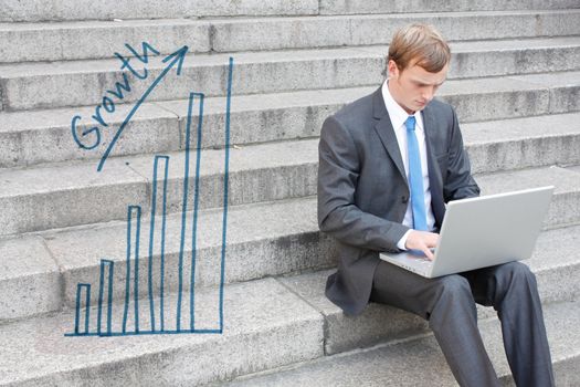 Business man sitting on stairs outdoor