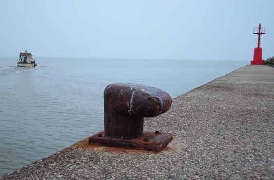 anchor in a port in italy and lighthouse
