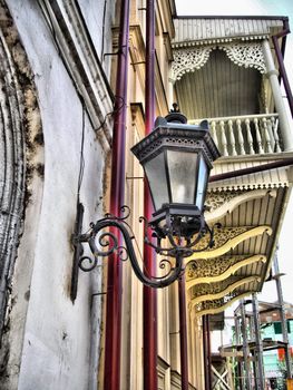 the street lamp on the wall in city centre of Tbilisi