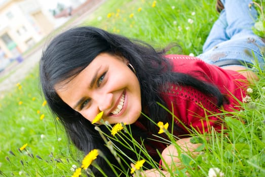 lovely female model.beautiful girl lying down of grass.