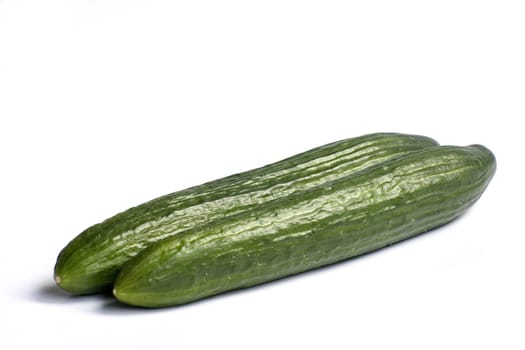 fresh green cucumbers isolated on a white background