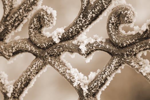Snow-clad railing,winter landscape,freezing patterns, winter .tone sepia