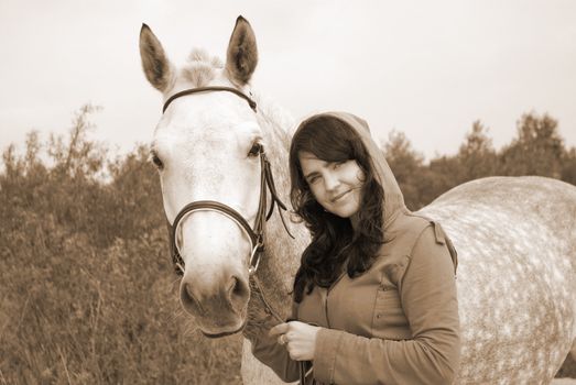 the romantic girl and horse.Contact with nature.tone sepia
