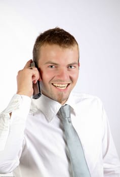 Cheerful Man Talking On The Phone In A Corporate Attire