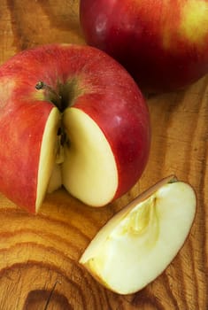 cut apple on wooden plate