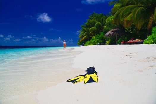 snorekl equipment on white sand beach at Maldives
