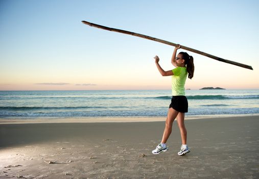 Woman doing exercises during sunset with sunglasses in Florianopolis, Santa Catarina, Brazil, Nikon D3S, Nikon 24-70mm, RAW shooting.