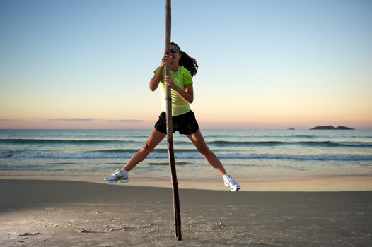 Woman doing exercises during sunset with sunglasses in Florianopolis, Santa Catarina, Brazil, Nikon D3S, Nikon 24-70mm, RAW shooting.