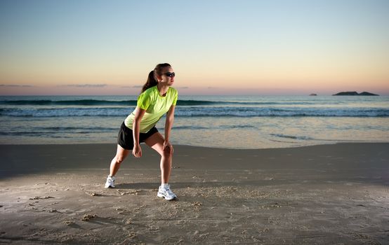 Woman doing exercises during sunset with sunglasses in Florianopolis, Santa Catarina, Brazil, Nikon D3S, Nikon 24-70mm, RAW shooting.