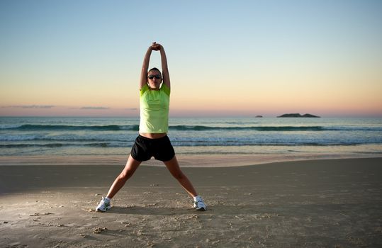 Woman doing exercises during sunset with sunglasses in Florianopolis, Santa Catarina, Brazil, Nikon D3S, Nikon 24-70mm, RAW shooting.