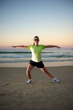 Woman doing exercises during sunset with sunglasses in Florianopolis, Santa Catarina, Brazil, Nikon D3S, Nikon 24-70mm, RAW shooting.