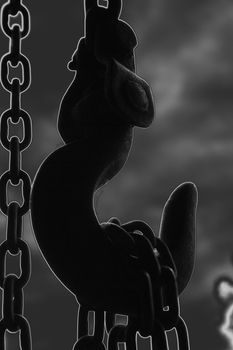 chain suspended in air over lighter background
