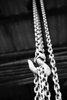 chain suspended in air over lighter background