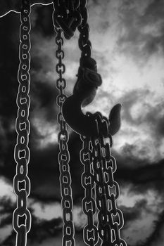 chain suspended in air over lighter background