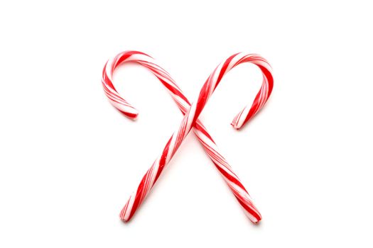 Two red and white Christmas candy canes, isolated on white