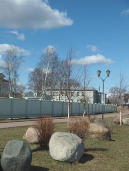 Stones and lantern on coast of the Onega lake