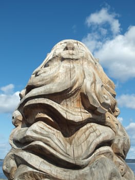 Wooden figure on quay of the Onega lake. Petrozavodsk, Russia